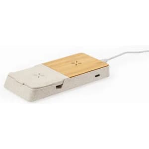 A charging pad featuring a wooden surface and a light grey base with a cable connected.