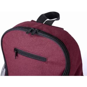 A burgundy backpack with a zippered pocket and black accents, featuring a padded handle on top.