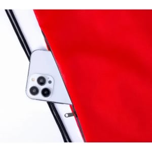 A red bag with a zipped pocket containing a smartphone. The bag features a sleek, smooth surface.