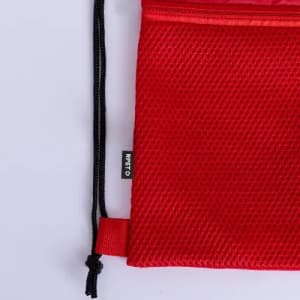 A red mesh drawstring bag with a black cord closure and a small tag.