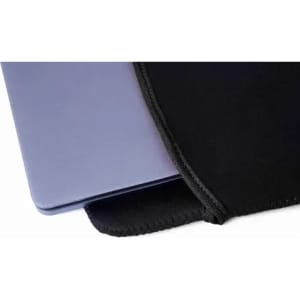 A laptop sleeve in black material partially covering a sleek purple laptop. The sleeve features a stitched edge.