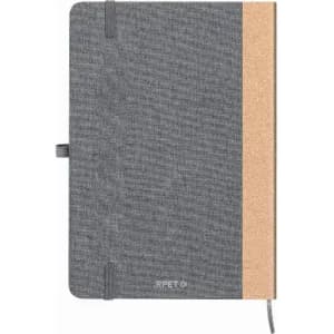 A notebook featuring a grey fabric cover with a cork accent on one side, and an elastic band for closure.