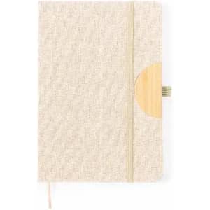 A notebook with a natural textured cover and a bamboo accent, featuring a ribbon bookmark.
