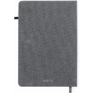 A grey notebook with a textured cover and ribbon bookmark, featuring a logo on the front.