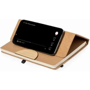 A phone stand and notebook set in natural tones, featuring a cork cover and wooden accent for stability.