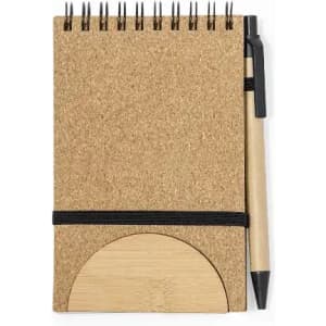 A cork notebook with a spiral binding and a bamboo cover, accompanied by a black pen.