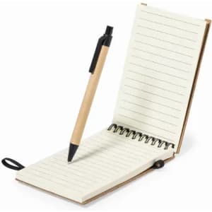 A notebook with lined pages and a black pen resting atop, featuring a brown cover and a spiral binding.