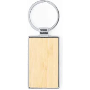 A keyring featuring a rectangular bamboo insert with a silver metal frame and ring.