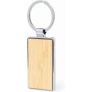A keyring with a rectangular bamboo panel and a shiny silver metal frame. It features a split ring for attaching keys.