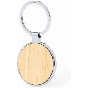 A keyring with a round silver metal frame and a wooden centre, featuring a natural wood grain pattern.