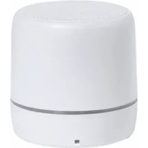 A white portable speaker with a smooth surface and a silver band around the base, featuring a logo on the front.