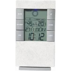 A digital weather station with a white casing displays time, temperature, humidity, and weather forecasts.