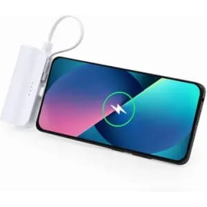 A smartphone with a colourful screen displaying a charging symbol, paired with a white wireless charger.