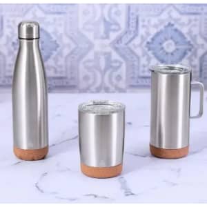 A drinkware set featuring stainless steel mugs and a bottle with cork bases. The items exhibit a sleek, modern design.