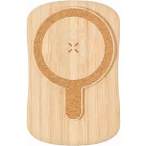 A bamboo phone holder with a circular cork insert and a cutout for charging. It features a natural wood finish.