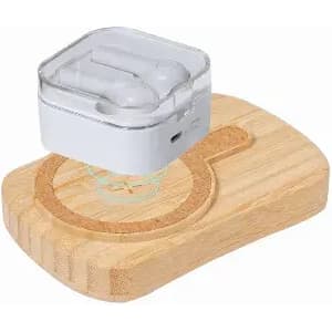 A wireless earbud case sits on a wooden charging pad. The case is white with a transparent lid, and the pad is light brown.