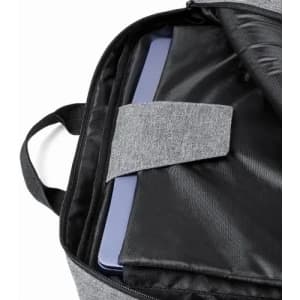A grey bag interior featuring a padded compartment and a slim electronic device secured with a velcro strap.