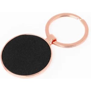 A round keyring with a rose gold finish and a black, textured surface for personalisation.