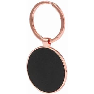 A keyring with a rose gold metal finish and a smooth black circular pendant. It features a simple design.