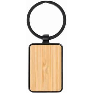 A key ring with a rectangular wooden panel and a black circular attachment. The wood has a natural grain pattern.
