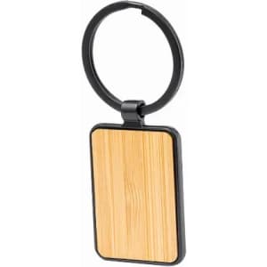 A keyring featuring a rectangular wooden panel with a black metal frame and a circular keyring attachment.