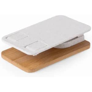 A chopping board set featuring a light grey composite top with a bamboo base and branding on the surface.