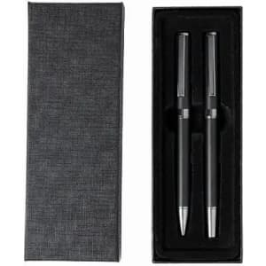 A gift box containing two black pens with silver accents, set against a black background.