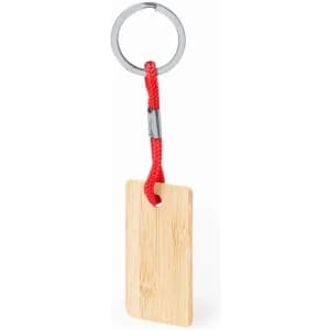 A keyring with a bamboo tag attached by a red cord and a metal ring.