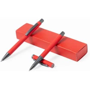 A set of two red pens resting on a matching red box. The pens have a sleek design with black accents.