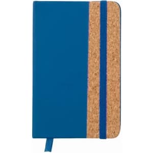 A blue notebook with a cork section and a blue elastic band, featuring a ribbon bookmark.