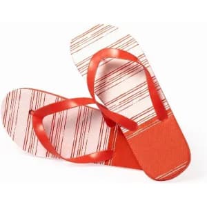 A pair of red flip-flops with a striped design and red straps, featuring a textured sole.