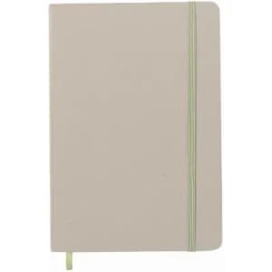 A notebook in light beige with a green elastic band closure and a matching ribbon bookmark.