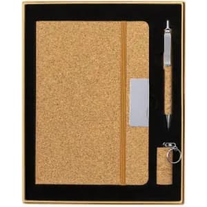 A cork notebook set featuring a cork-covered notebook, a pen, and a keychain, all presented in a black and gold box.
