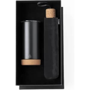 A drink bottle in a black box, featuring a sleek black design with a cork base and a protective sleeve.