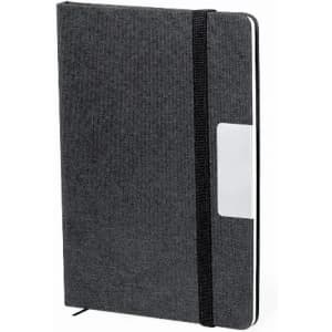 A notebook featuring a black textured cover, an elastic strap, and a pocket on the front.