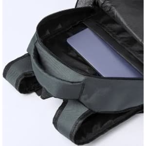 A grey backpack interior showing a compartment with a purple laptop nestled inside.