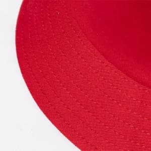 A red hat with a wide brim, featuring a textured fabric surface.
