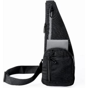 A black sling bag with multiple zippered compartments and an adjustable strap.