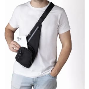 A black sling bag worn across the body, featuring multiple zippered pockets and a phone holder.