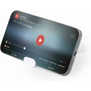 A smartphone stands on a white holder, displaying a video playback screen with a red play button.