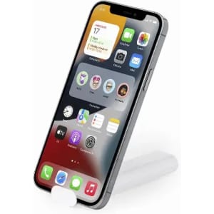 A smartphone displayed on a white stand with various app icons on the screen. The phone has a sleek grey finish.