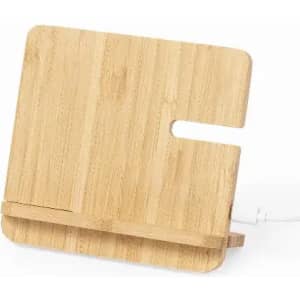 A wooden phone stand made of bamboo with a minimalist design and a slot for cable management.