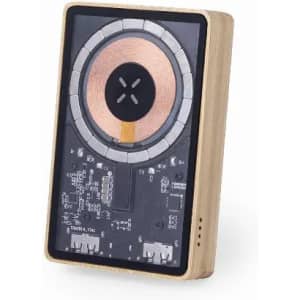A wireless charger with a wooden frame and a transparent surface, displaying circuit components and a central charging pad.