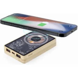 A wireless charger with a metallic design positioned near a smartphone, showing charging indicators.