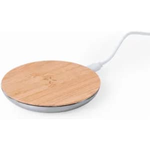 A round wireless charger with a wooden top and silver base, connected by a white power cord.
