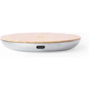 A wireless charging pad with a wooden top and a silver base, featuring a USB-C port.