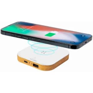 A wireless charger with a wooden base and multiple ports, paired with a smartphone above it, indicating charging.