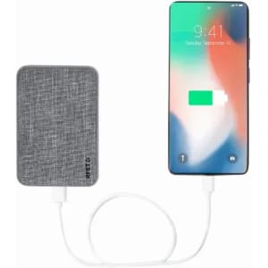A portable charger in grey fabric design connected to a smartphone displaying a charging icon.