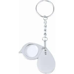 A keychain magnifier with a circular lens, silver-toned, featuring a teardrop shape and a logo.
