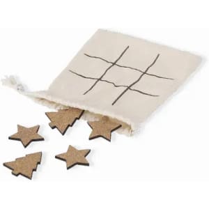 A drawstring bag containing wooden playing pieces shaped like stars and trees, with a printed grid on the bag.